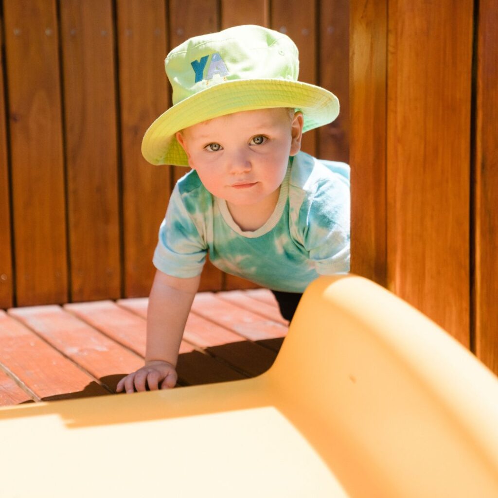 child playing outdoor slide